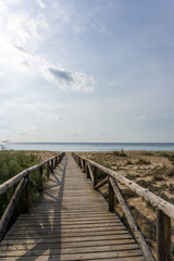  long wooden boardwalk and beach access leads to beach and glistening ocean