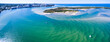 © Andrew McInnes/Austockphoto - Aerial image of two small sailboats sailing over rippled sandbars.