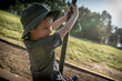 © Brayden Howie/Austockphoto - 5 year old mixed race boy plays outdoors in a playground
