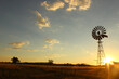 © Clare Seibel-Barnes/Austockphoto - Windmill silhouette on a farm at sunset