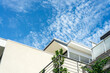 © Gillian Vann/Austockphoto - modern generic white apartment building against blue sky