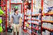 © Clare Seibel-Barnes/Austockphoto - Young man in hardware store shopping for house improvement project