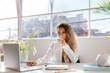 © Jodie Johnson/Austockphoto - Female sipping water while working in a bright clinical white office