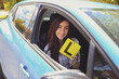 © Sammy Bailey/Austockphoto - Teenage girl holding L plate