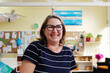 © Sammy Bailey/Austockphoto - Happy teacher in kindergarten classroom, childcare, preschool educator