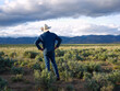 © John Kelly/Tetra Images - USA, Utah, Rear view of man standing in desert landscape