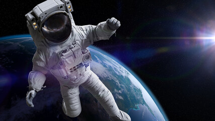 Wall Mural - astronaut during spacewalk in earth orbit