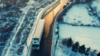 Wall Mural - Semi-trailer truck leaves the exit of the logistics park. Aerial following shot