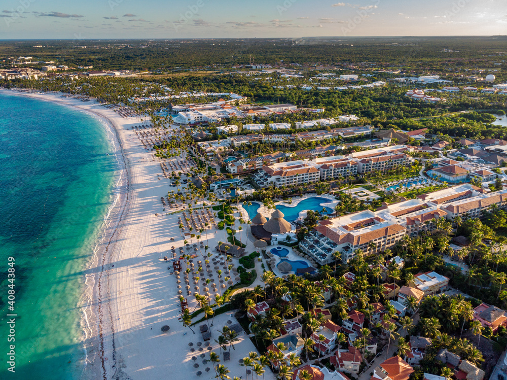 Aerial drone view of beach resort hotels with pools, umbrellas and ...