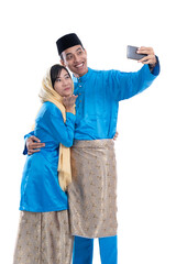 Wall Mural - muslim couple talk to family using smartphone isolated over white background