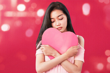 Sticker - Asian woman holding a red hearts with sad expression