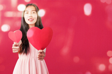 Poster - Asian woman holding the red heart