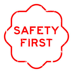 Sticker - Grunge red safety first word rubber seal stamp on white background