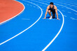 © Tom Wang - Male  athlete on  race track is ready to run