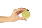 Fototapeta Mapy - Female hand hold half of lime, isolated on white background