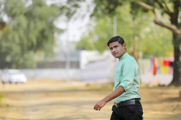 Wall Mural - Young handsome indian man giving expression