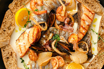 Closeup on seafood saute mix with cream sauce and herbs