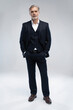 © opolja - Full length shot of a mature businessman wearing a suit looking at camera