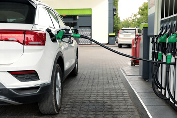 Refueling modern car at gas filling station, closeup