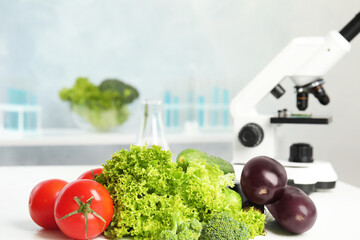 Wall Mural - different fresh vegetables on table in laboratory, space for text. poison detection