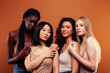 © iordani - SaveDownload Previewyoung pretty asian, caucasian, afro woman posing cheerful together on brown background, lifestyle diverse nationality people concept