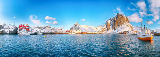 Wall Mural - Astonishing winter view on Hamnoy village with port and snowy  mountain peaks  on background.