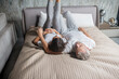 © zinkevych - Man and woman lying resting on bed