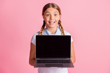 Sticker - Photo of optimistic girl hold laptop wear white t-shirt isolated on pink color background