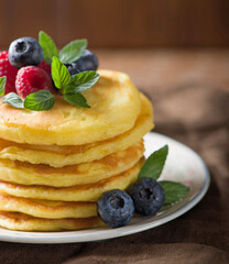 Poster - Stack of pancakes with fresh berries, close-up.