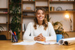 © Drobot Dean - Beautiful young woman entrepreneur in office