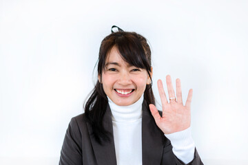 Beautiful  business woman waving for greeting video conference