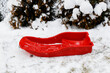 View of a red sledge in a winter landscape