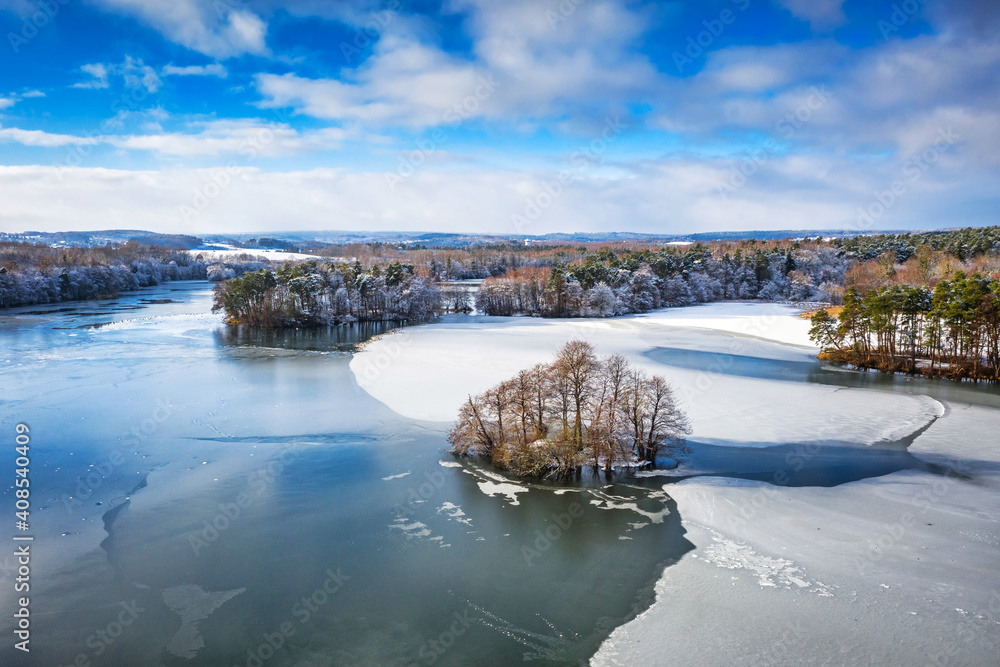 Aerial landscape of the frozen lake in Poland at winter - obrazy, fototapety, plakaty 
