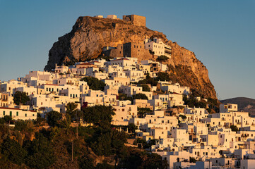 Wall Mural - Distant view of Skyros town or Chora, the capital of Skyros island in Greece at sunset