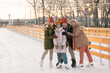 © pressmaster - Happy family on ice rink