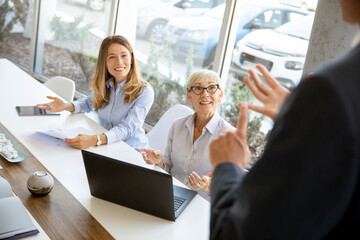 Group of business people working together and preparing new project on a meeting in office