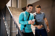 © NDABCREATIVITY - Handsome fit men friends talking, smiling after workout in gym