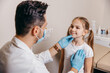 © Ankor_stock. - Arab or Turkish doctor examines a little girl before vaccination