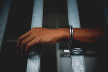 Prisoner In Prison With Handcuff.