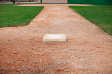 Selective Focus Low Angle View Of A Baseball Infield Looking Toward Home From Third Base