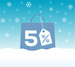© elnurbabayev - Blue shopping bag with 5% text and a snowflake percent design price tag label on it on snow background. For winter sale campaigns.