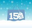 © elnurbabayev - Blue shopping bag with 15% text and a snowflake percent design price tag label on it on snow background. For winter sale campaigns.