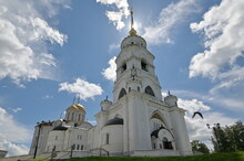 Holy Assumption Cathedral, Magnificent Historical Landmark In The Town Of Vladimir, Russian "Golden Ring". A Bird Flies In Beautiful Sky, Summer Sun Is Shining.