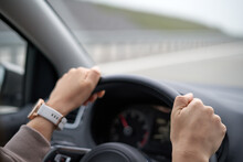 Driver Hands On Steering Wheel