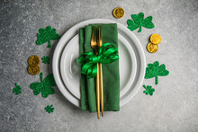 Beautiful Festive Table Setting For St.Patricks Day With Cutlery And Lucky Symbols. Copy Spase In Center. Flat Lay.