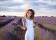 © Cavan Images - pretty woman in a lavender field