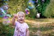 © Volodymyr Shevchuk - little girl looking at soap bubbles