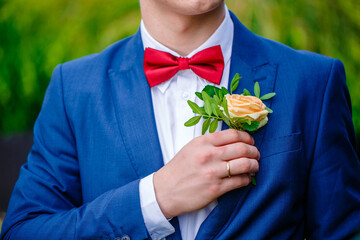 Red bow tie with white shirt closeup