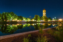 The Spokane Washington Clocktower In Riverfront Park Shines Above The Spokane River During A Busy Festival In Riverfront Park, In Spokane Washington, USA