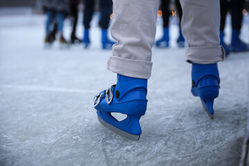 Canvas Print - Person skating at outdoor ice rink, closeup